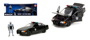 FORD USA TAURUS LX DETROIT POLICE 1986 WITH ROBOCOP FIGURE BLACK 1:24