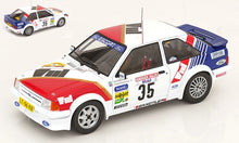 Indlæs billede til gallerivisning FORD ENGLAND ESCORT MKIII RS TURBO N 35 RALLY HUNSRUCK 1985 STIG ANDERVANG - ANDRE SCHOONENWOLF WHITE RED BLUE 1:18