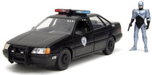 Indlæs billede til gallerivisning FORD USA TAURUS LX DETROIT POLICE 1986 WITH ROBOCOP FIGURE BLACK 1:24