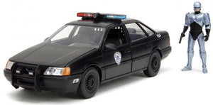 FORD USA TAURUS LX DETROIT POLICE 1986 WITH ROBOCOP FIGURE BLACK 1:24