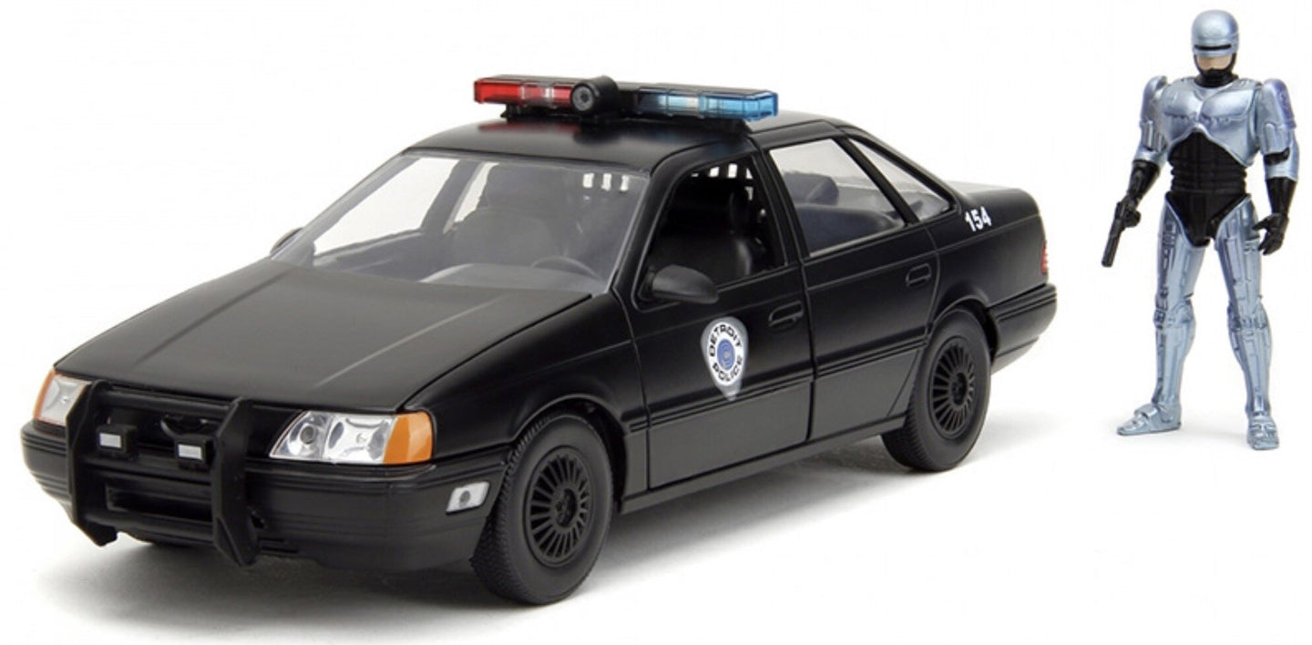 FORD USA TAURUS LX DETROIT POLICE 1986 WITH ROBOCOP FIGURE BLACK 1:24