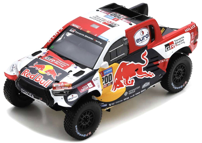 TOYOTA HILUX T1 GR DKR PICK-UP TEAM TOYOTA GAZOO RACING RED BULL N 200 WINNER RALLY DAKAR 2023 NASSER AL-ATTIYAH - MATHIEU BAUMEL WHITE BLUE RED YELLOW 1:18